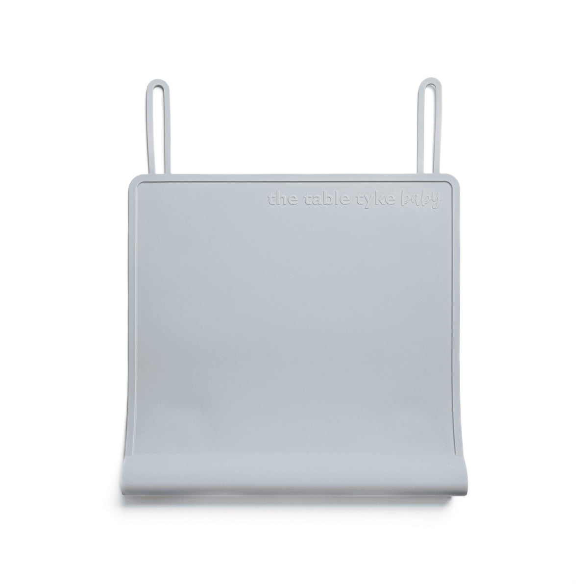 The Table Tyke placemat with suction cups grips the table edge to prevent sliding during meals