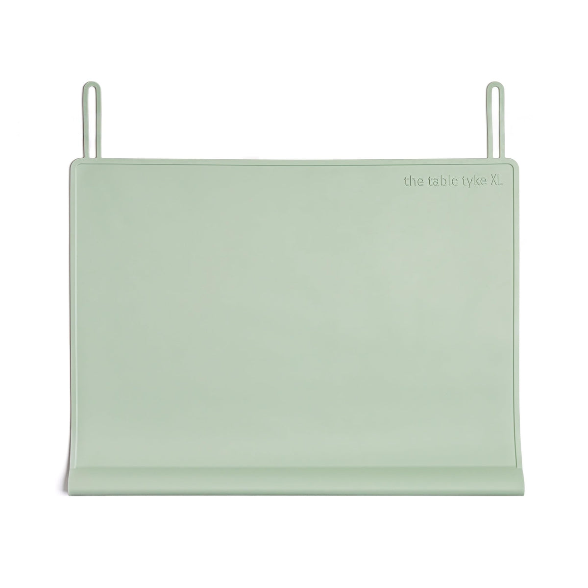 The Table Tyke XL placemat in sage green with teething edge cushions little mouths during meals.