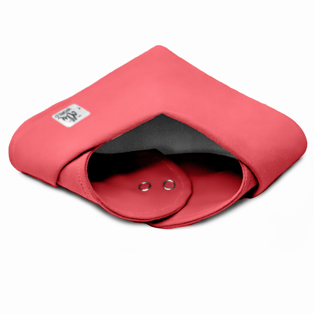 The Ollie sunset bib with adjustable snaps shows growing-fit versatility.