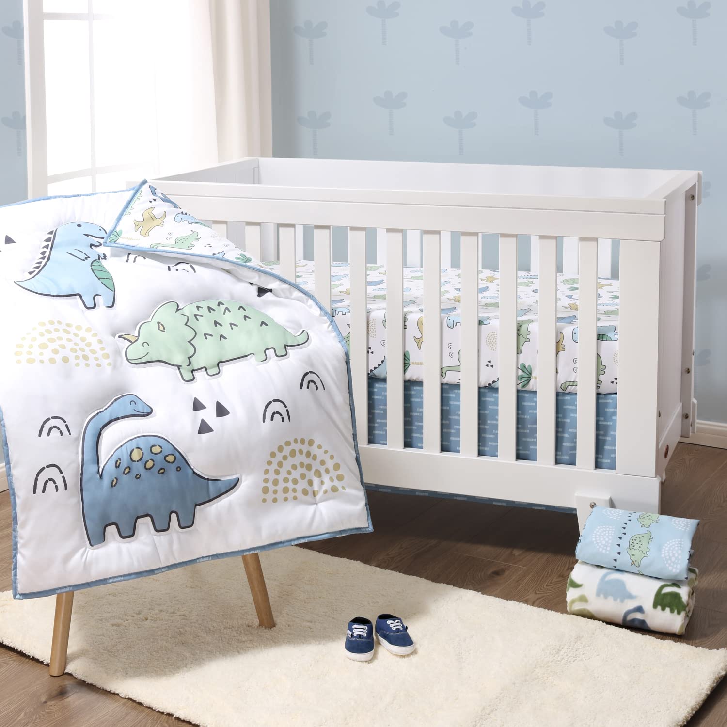 The Peanutshell blue dino nursery detail highlights playful decor accents.