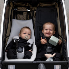 Thule Chariot infant sling gray machine washable fabric for easy cleaning.