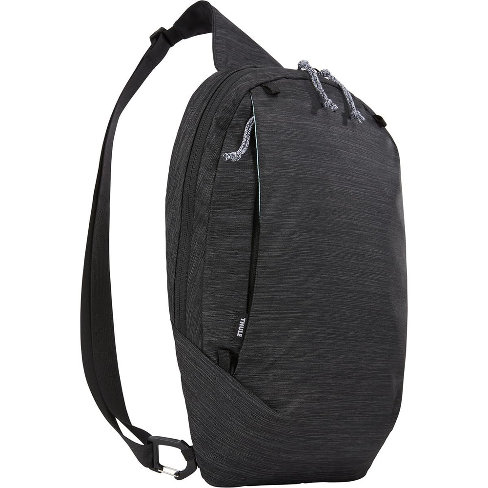 Thule Sapling Sling Pack attached to the carrier for expanded adventure storage