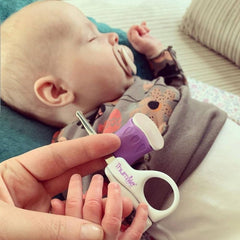 Thumble Baby Nails scissors positioned during a precise nail trim for safety