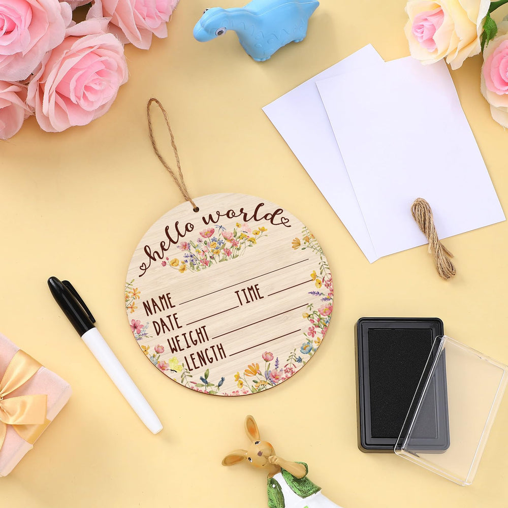 Thyle baby announcement sign setup with rope and components
