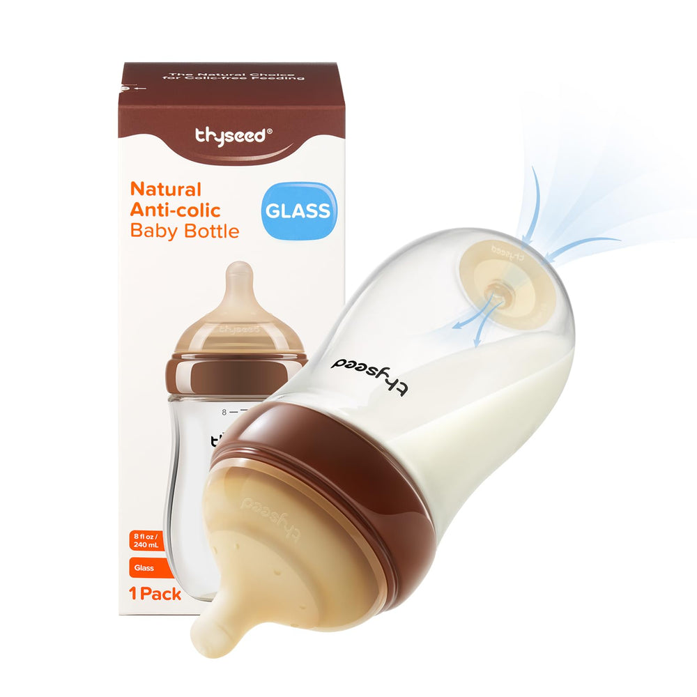 Thyseed Glass Anti-Colic Bottle top view highlights the base vent for smoother milk flow