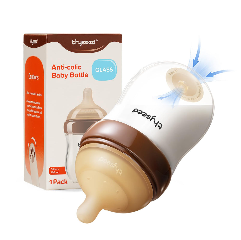 Thyseed glass anti-colic base vent bottle demonstrates air separation for smoother milk flow.