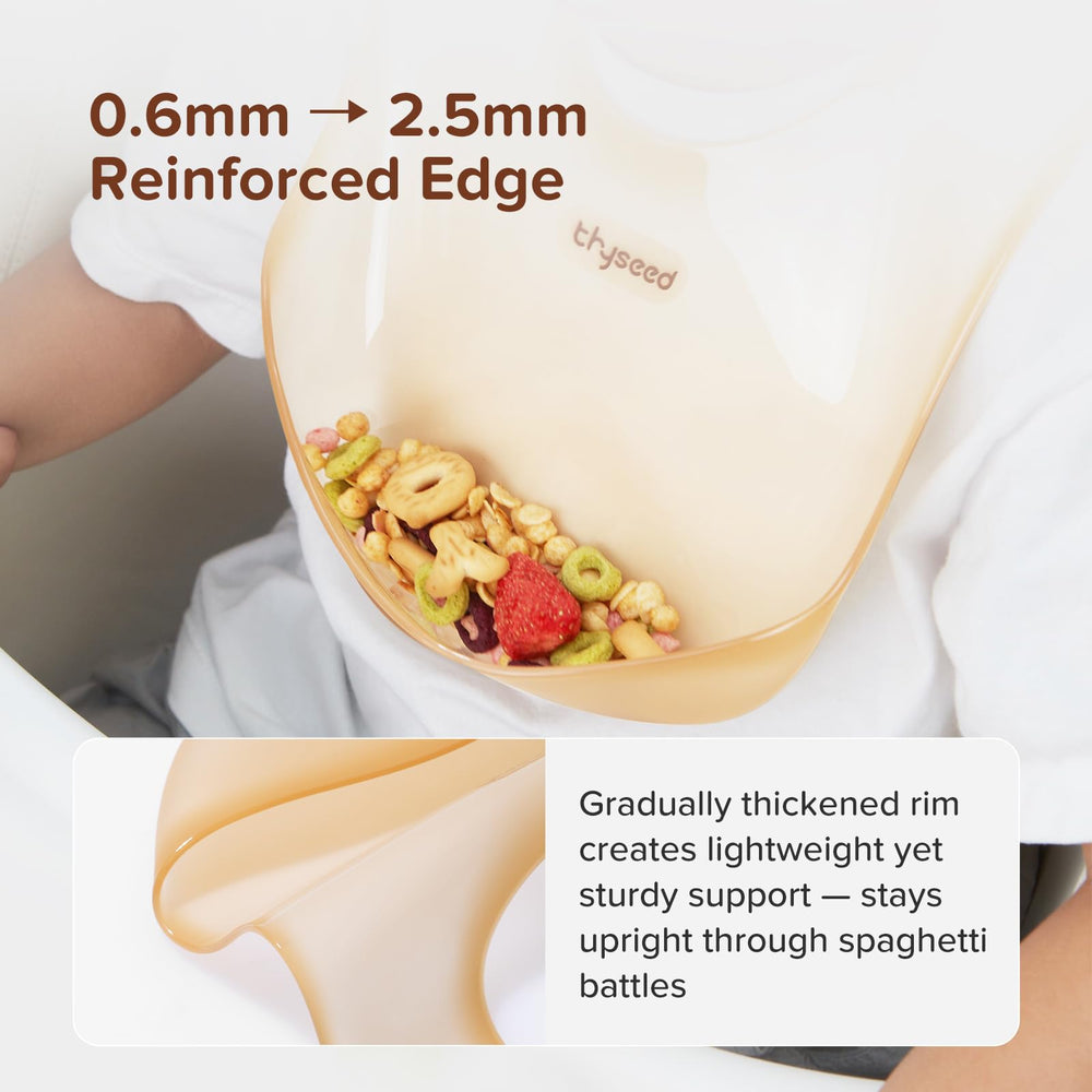 thyseed silicone bib in-table use demonstrates coverage over highchair tray
