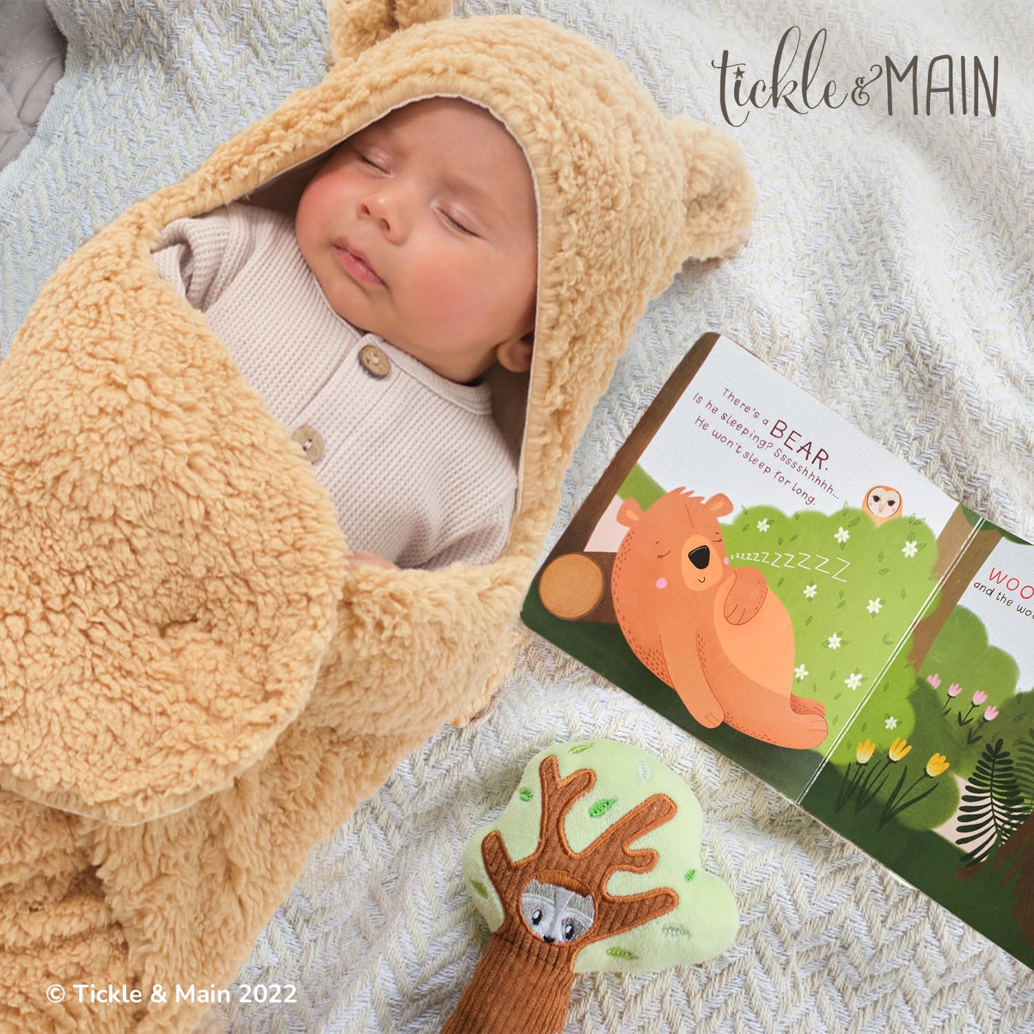 Tickle & Main plush tree rattle close-up showcases soft texture and shaker charm.