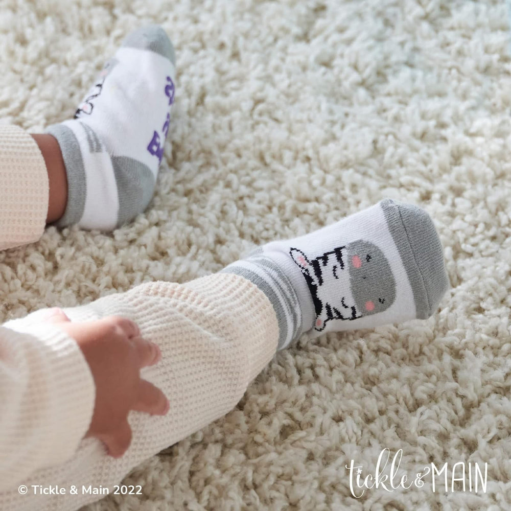 Tickle & Main Noah’s Ark giraffe socks provide soft warmth.