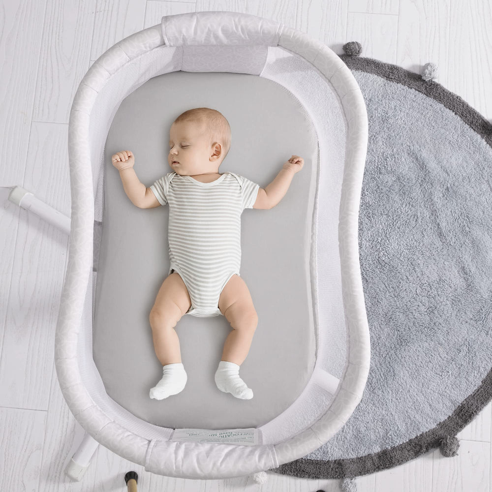 TILLYOU envelope-fit bassinet sheet demonstrates snug non-slip design for secure mattress coverage.