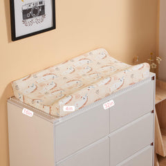 TILLYOU changing pad cover with elastic bottom and buckle holes for quick secure fit.