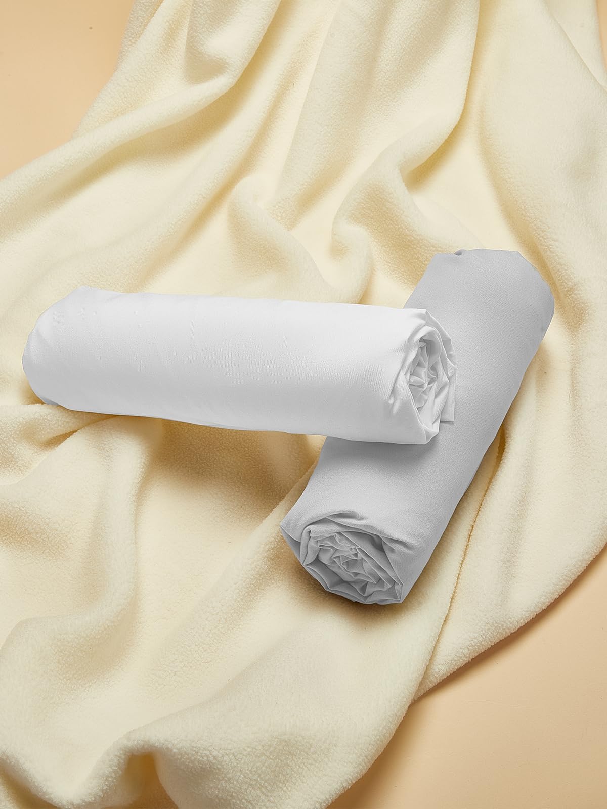 TILLYOU crib sheet shows looped elastic bottom for quick changes.