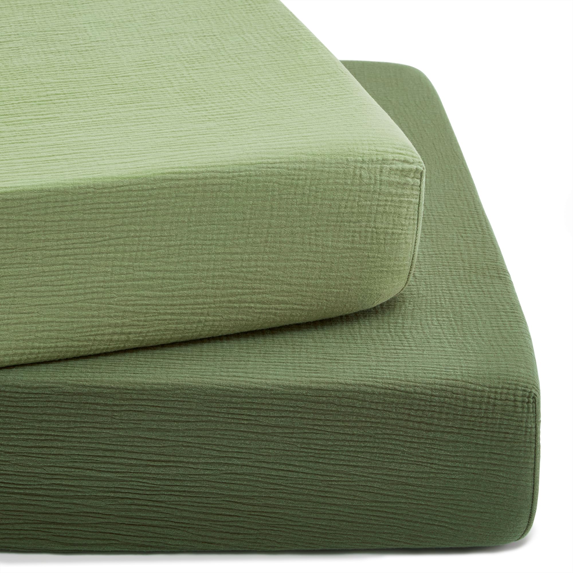 TILLYOU forest-green crib sheet on mattress shows snug fit with cotton softness.