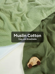TILLYOU light-green crib sheet on mattress highlights breathable fabric.