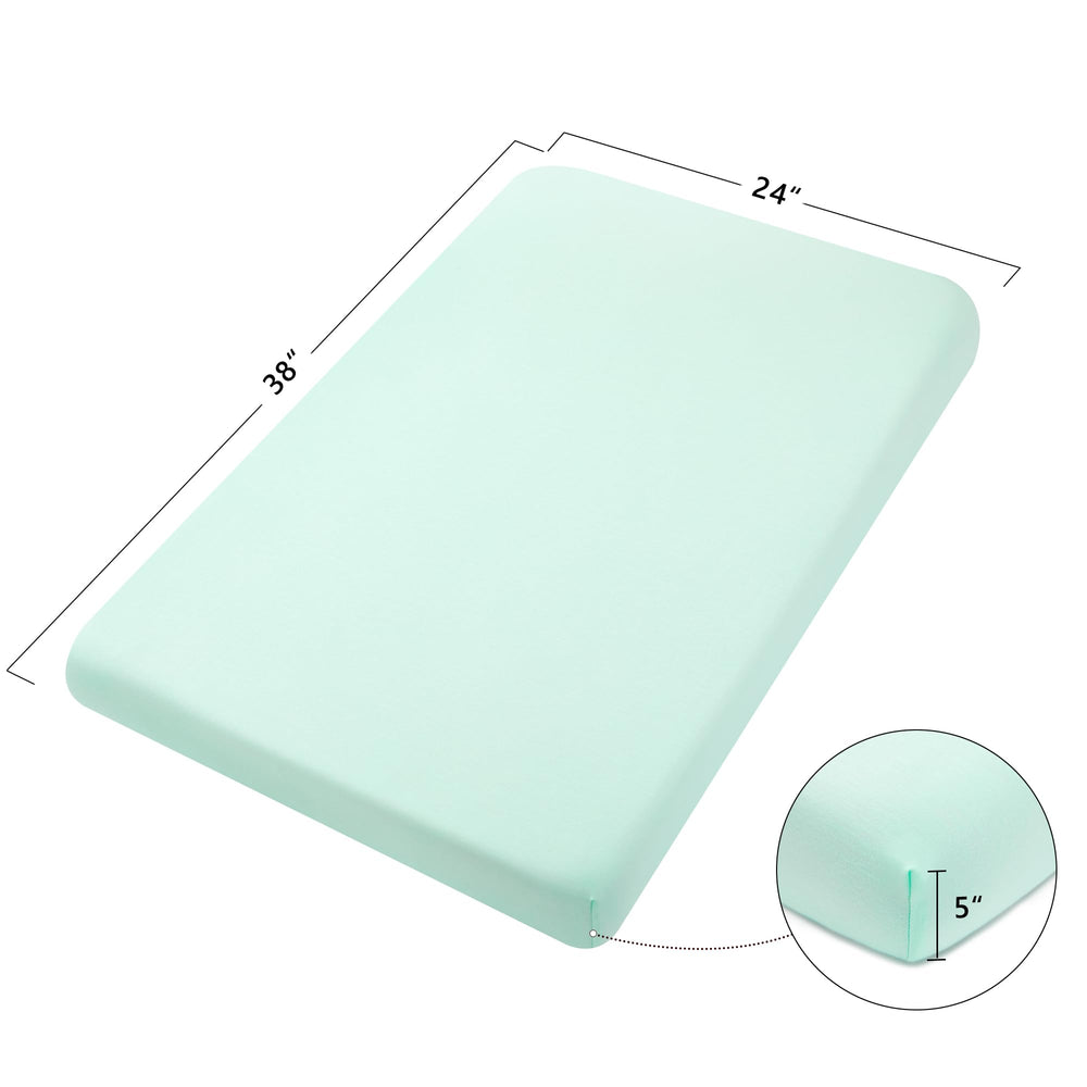 TILLYOU mini crib sheet on a mattress showing a 3-inch deep pocket for a secure fit.