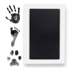 Tiny Gifts Clean Touch inkpad safely captures a baby's hands for lasting keepsakes.