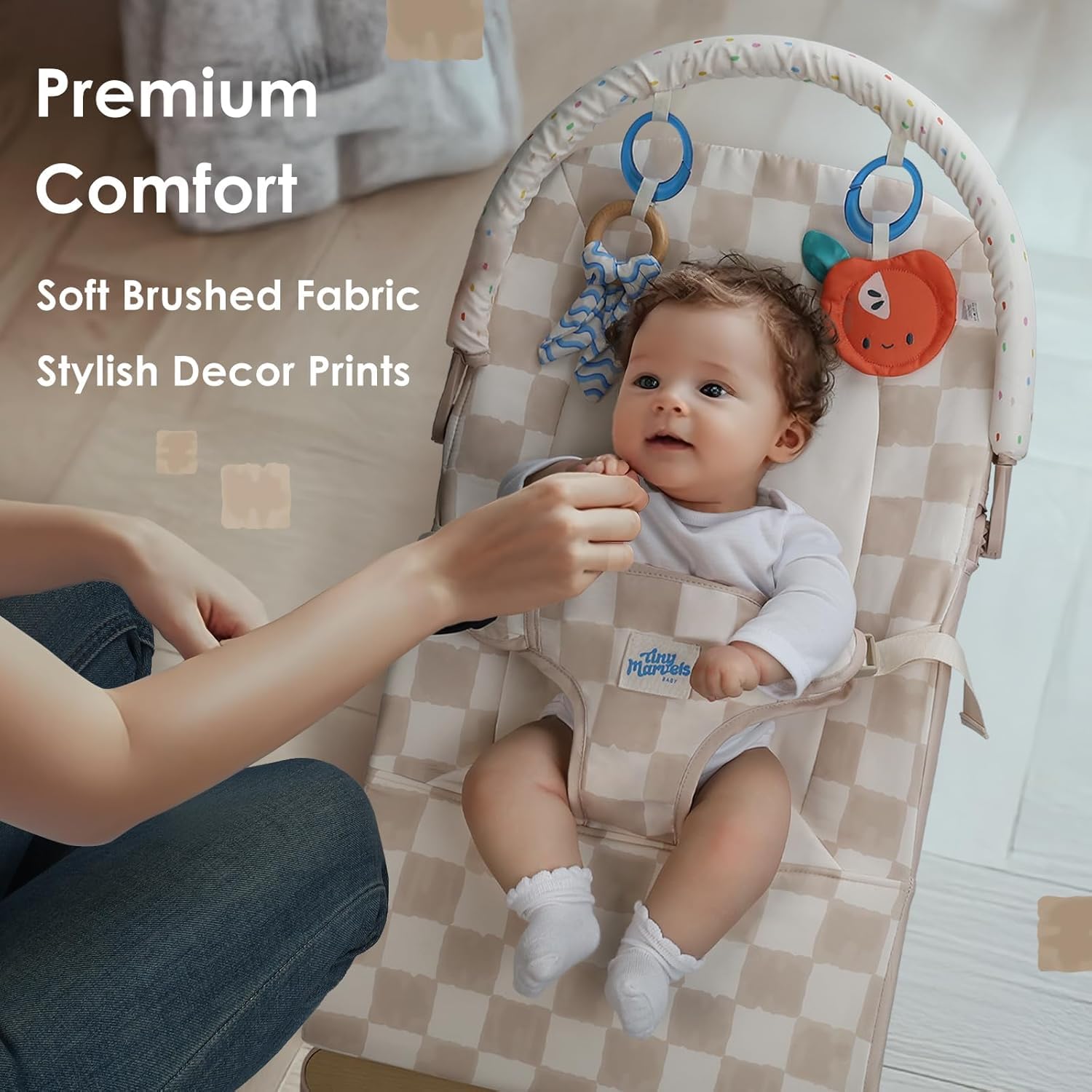 Tiny Marvels baby bouncer in use with motion soothing gentle play and bright toys.
