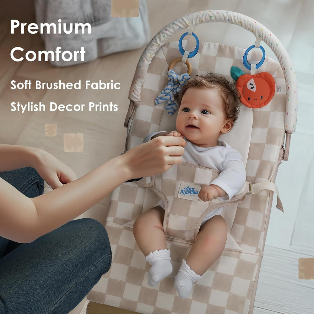 Tiny Marvels baby bouncer in use with motion soothing gentle play and bright toys.