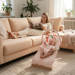Tiny Marvels baby bouncer pink floral toy bar with mirror – sensory play boosts curiosity and eye contact