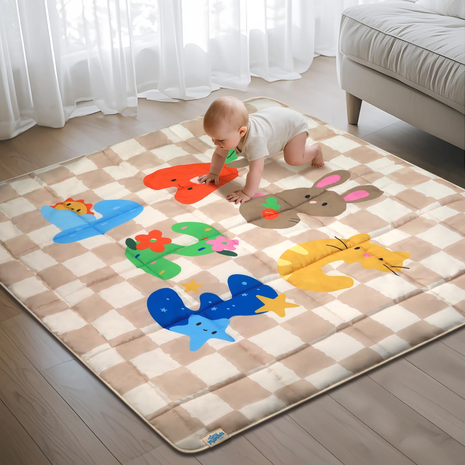 Tiny Marvels baby play mat folded portable for on-the-go play.