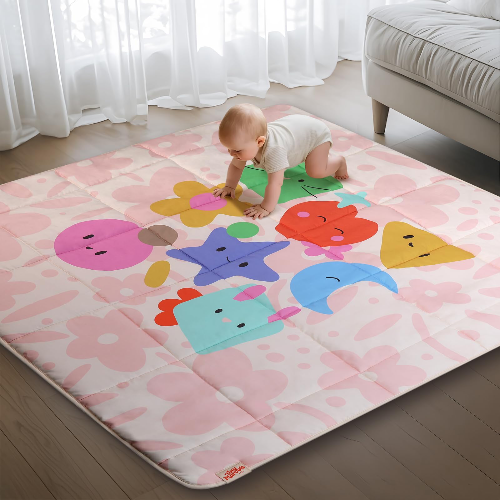 Tiny Marvels baby play mat pink floral folded for easy storage and transport.