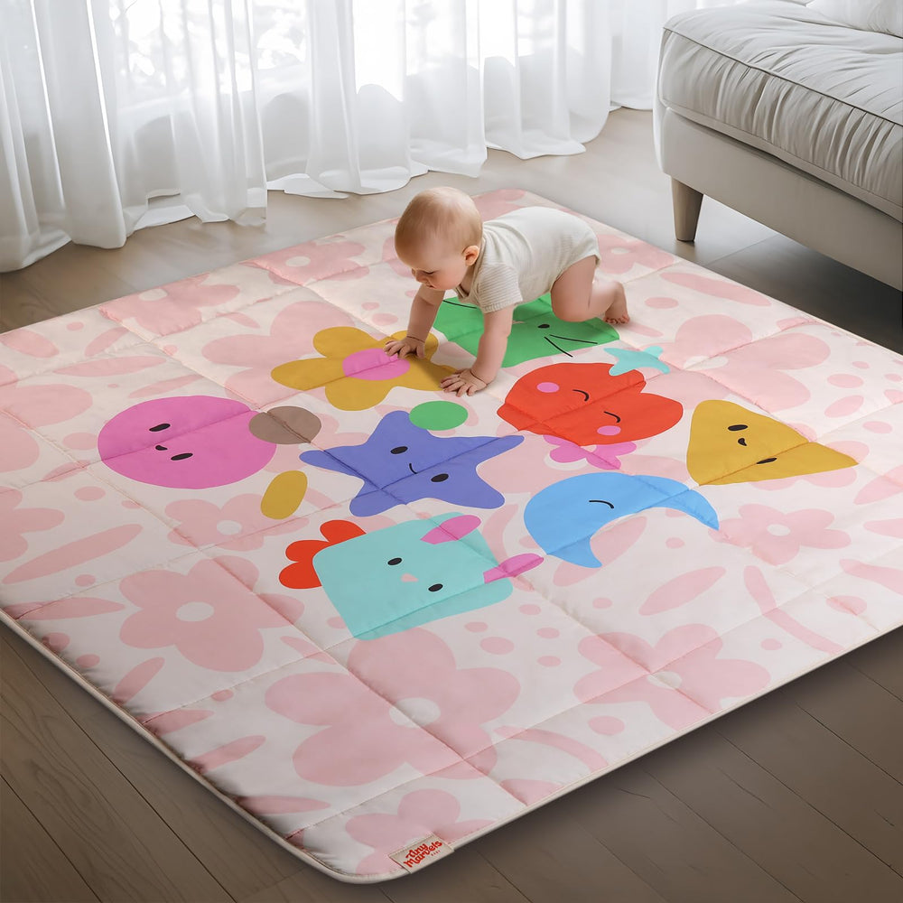Tiny Marvels baby play mat pink floral folded for easy storage and transport.