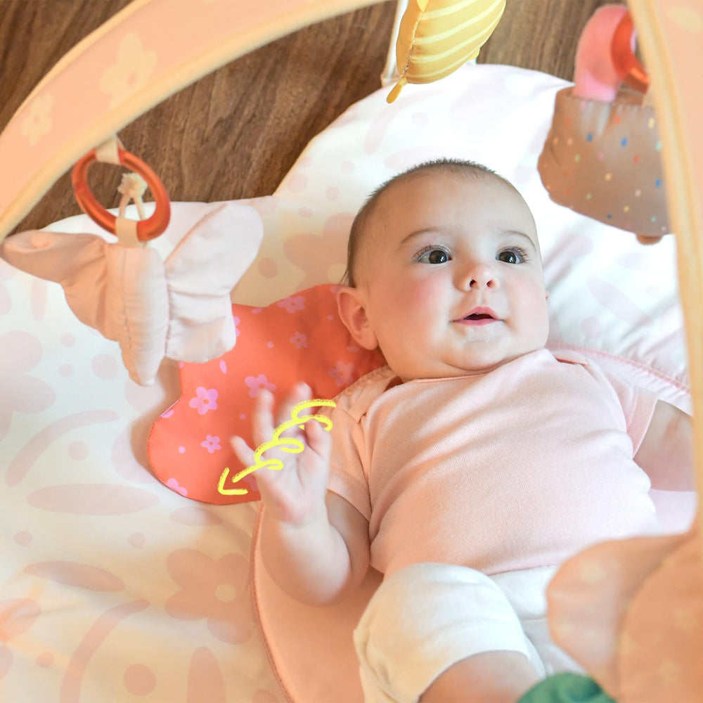 Tiny Marvels padded tummy-time mat showing soft surface for safe early muscle work