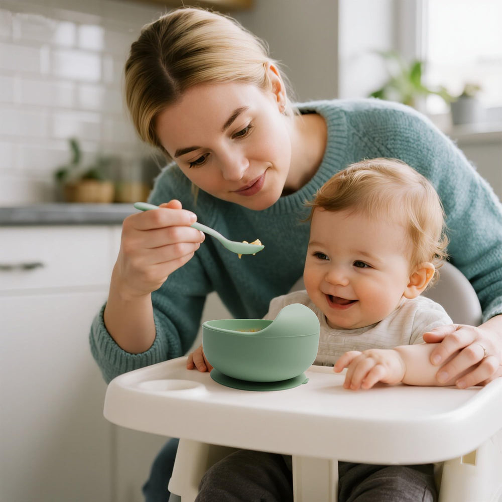 Tiny Tastes soft bib features built-in catcher for easier post-meal cleanup.
