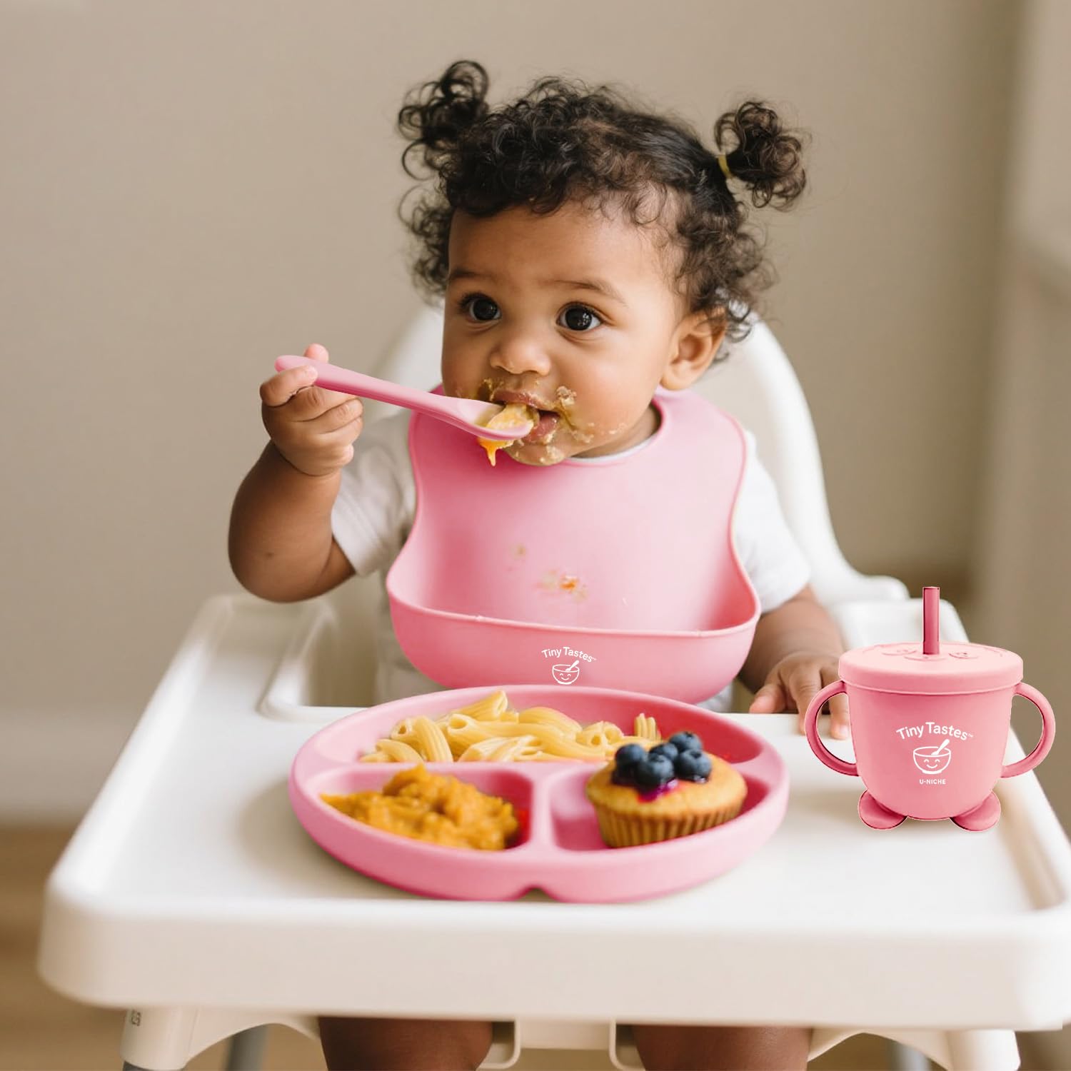 Tiny Tastes soft silicone spoon and fork soothe tiny hands during feeding.