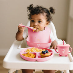 Tiny Tastes soft silicone spoon and fork soothe tiny hands during feeding.