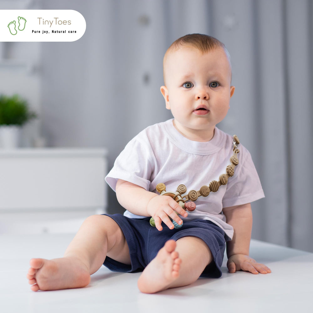 Tiny Toes teether textured surface provides gentle gum massage and sensory engagement.