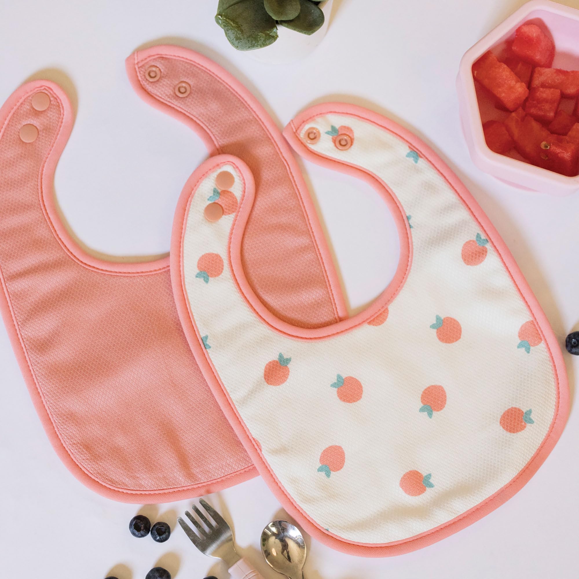 Tiny Twinkle bibs feature waterproof lining to guard against leaks while feeding and teething
