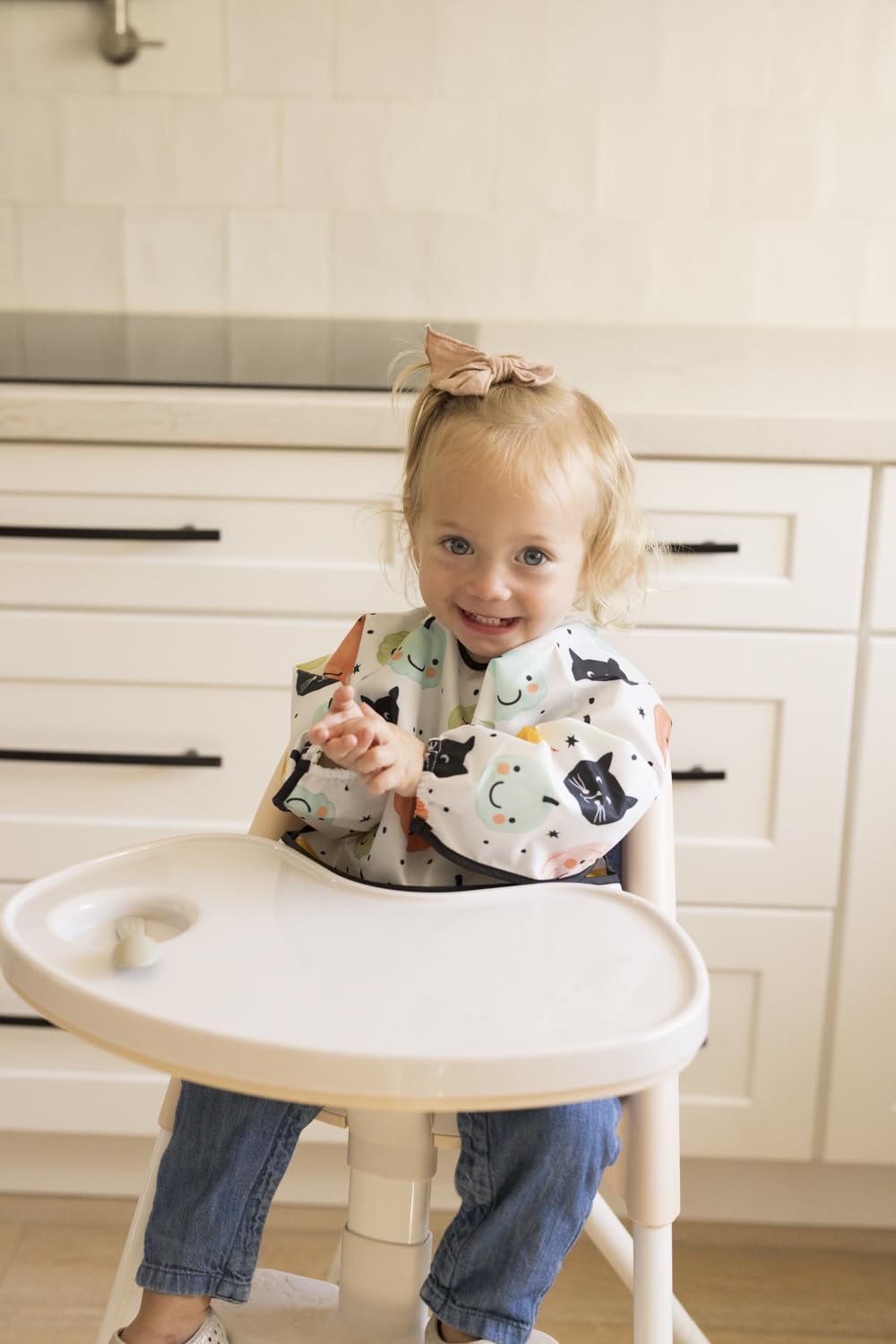 Tiny Twinkle baby bib cuffs detail highlights gentle elastic cuffs for comfy bending during meals