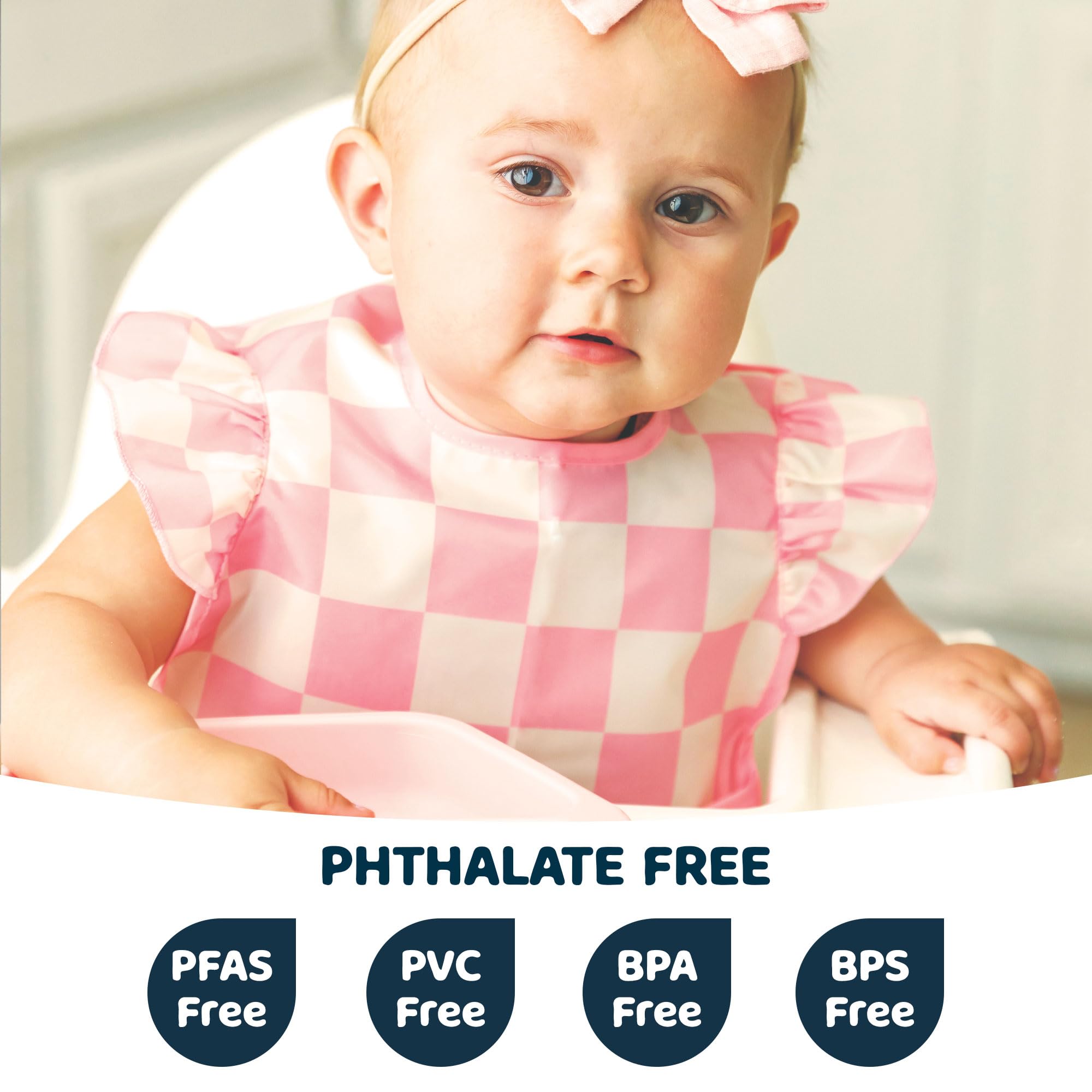 Tiny Twinkle waterproof bib pocket closeup shows deep catch-all for spills.