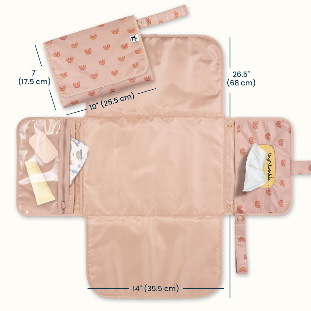Tiny Twinkle changing pad with wipes pocket enables one-handed diaper access.