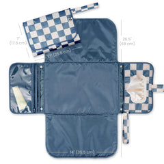 Tiny Twinkle changing pad with wipes pocket enables quick one-handed wipe access during diaper changes.
