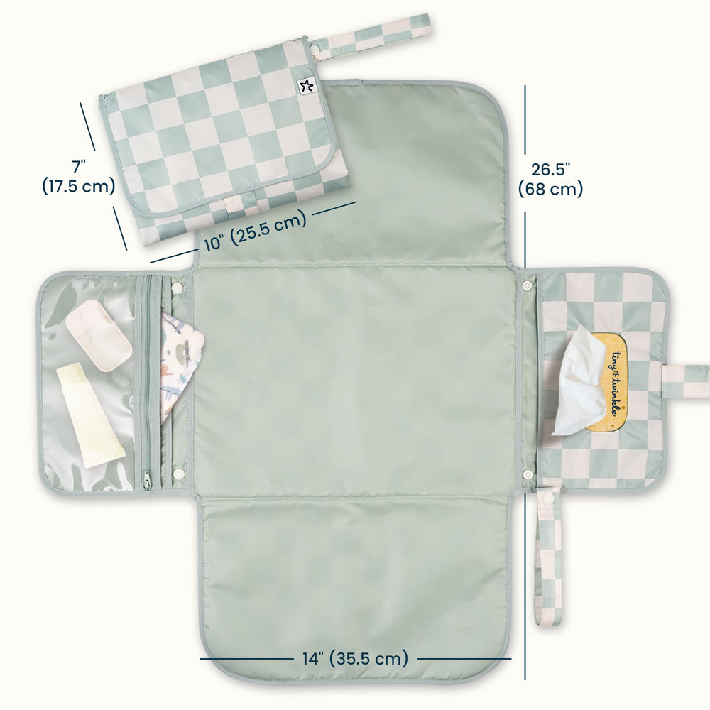 Tiny Twinkle changing pad with wipes pocket for quick access