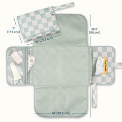 Tiny Twinkle changing pad with wipes pocket for quick access