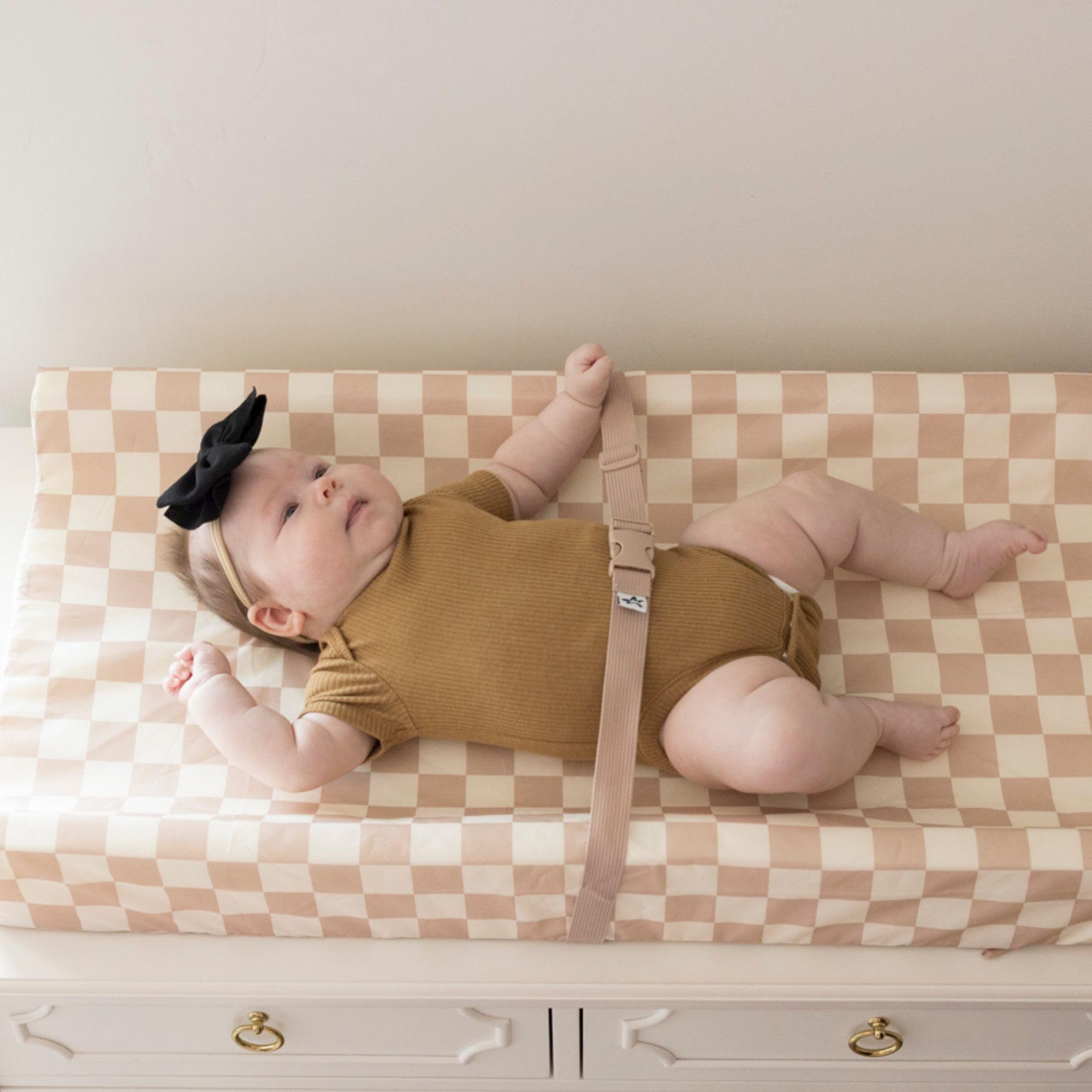Tiny Twinkle waterproof surface helps contain leaks and odors during changes.