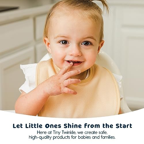 Tiny Twinkle Kaffle fabric bibs on baby, easy-care performance