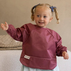 Tiny Twinkle long sleeve bib full-body-coverage during feeding.