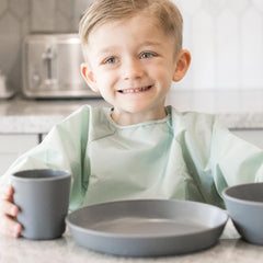 Tiny Twinkle long sleeve bib sage charcoal close-ups cuffs highlight flexible elastic cuffs.