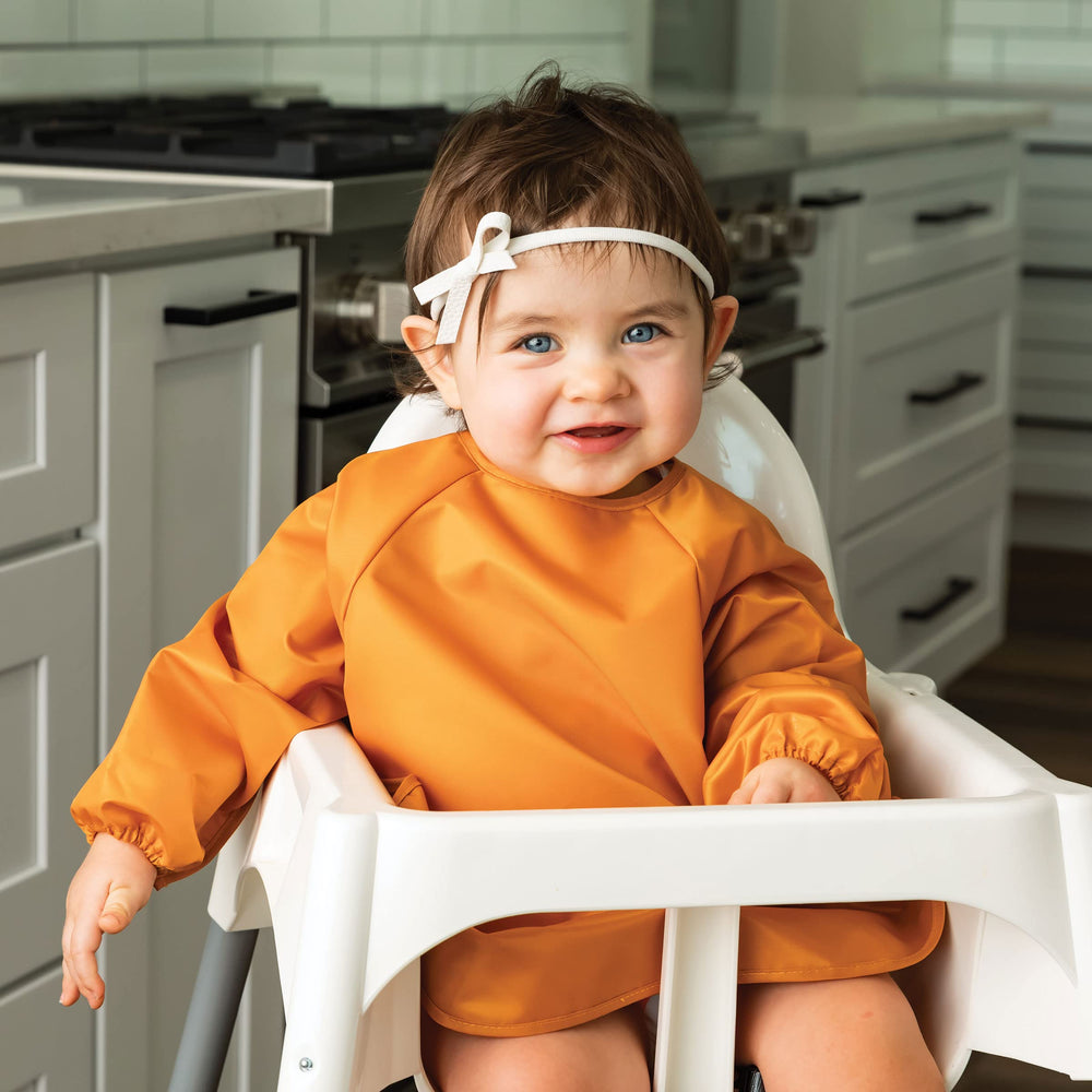 Tiny Twinkle long sleeve bib machine washable design for quick cleanup.