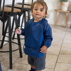 Tiny Twinkle long sleeve bib waterproof-closeup demonstrates durable spill-ready fabric.
