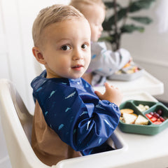 Tiny Twinkle long sleeve bib waterproof shell protects clothing from spills