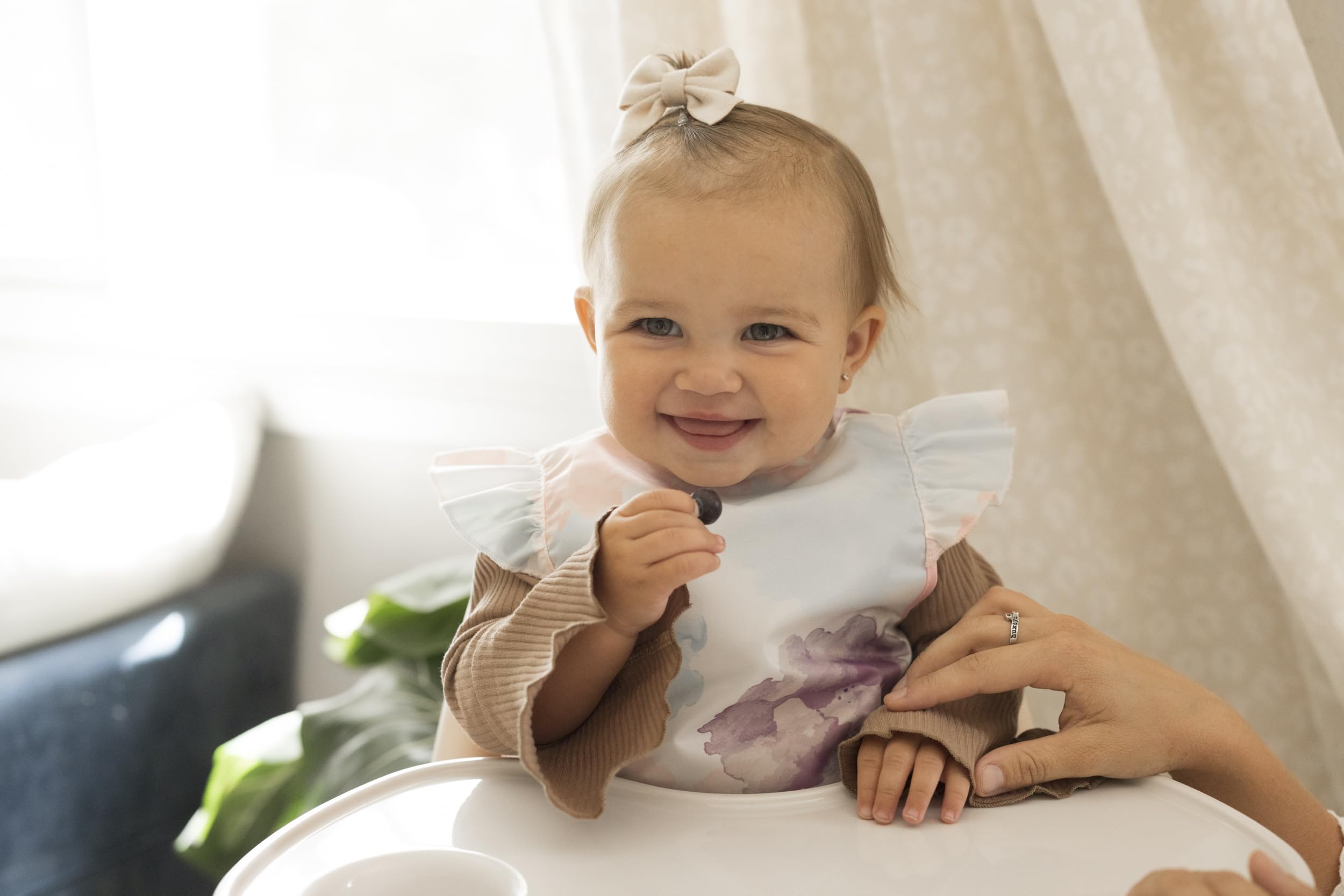 tiny twinkle mess proof bib mealtime fit demonstrates roomy design for growing toddlers.