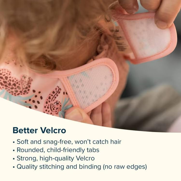 Tiny Twinkle mess-proof bib mealtime movement demonstrates flexible fit for active toddlers.