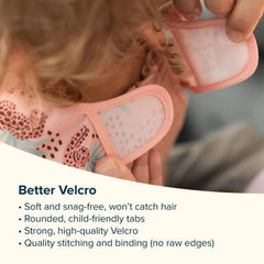 Tiny Twinkle mess-proof bib mealtime movement demonstrates flexible fit for active toddlers.