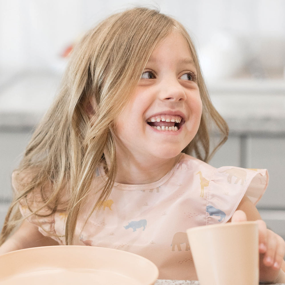 Tiny Twinkle mess-proof bib waterproof layer protects clothing during spills.