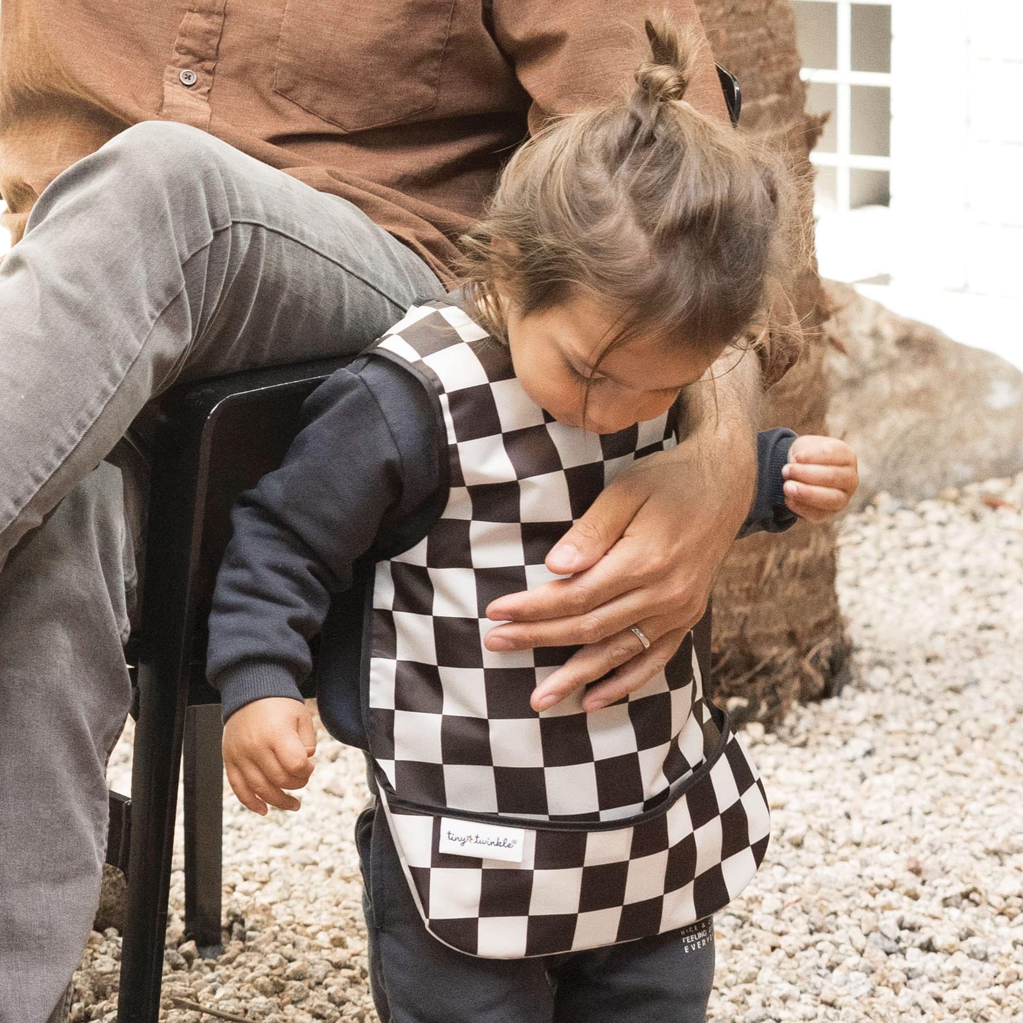 Tiny Twinkle Mess-Proof Bib waterproof mealtime cover demonstrates easy cleanup during messy meals